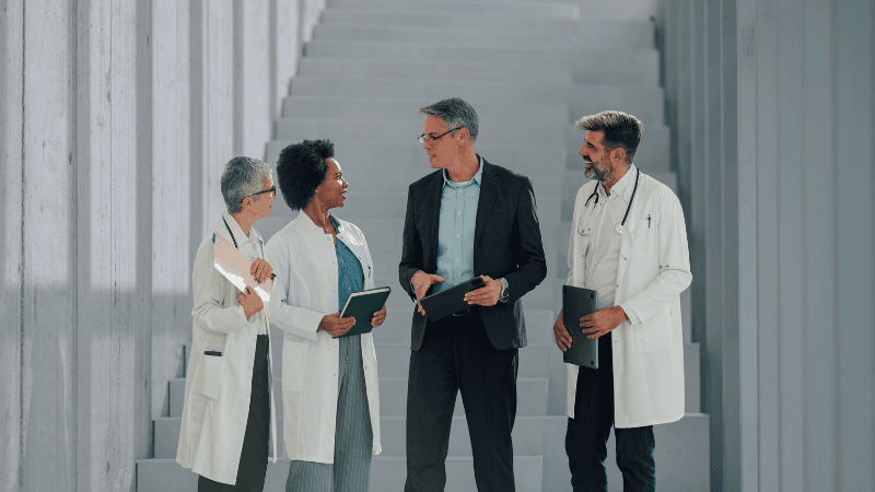 Senior Pharmaceutical And Life Sciences Leaders In Discussion During A Period Of Industry Change And Consolidation.
