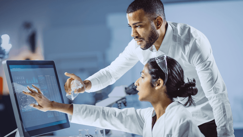 Technology Trends Reshaping The Life Sciences Industry In 2026 Life Sciences Researchers Reviewing Digital Data On A Screen In A Laboratory.